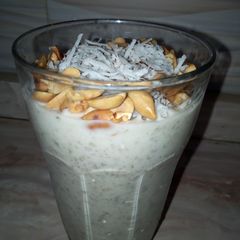 A picture of Yoghurt and fura garnish with coconut and groundnut.