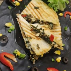 A picture of Cheesy spinach roti quessadillas.