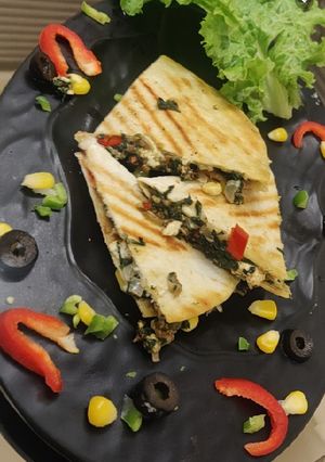 A picture of Cheesy spinach roti quessadillas.