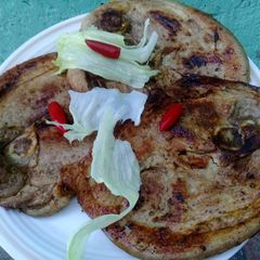 A picture of Pan grilled pork with chillis.