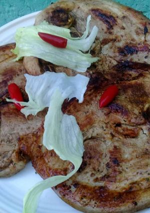 A picture of Pan grilled pork with chillis.