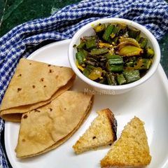 A picture of Bhindi and Onion Fry with roasted cumin powder.