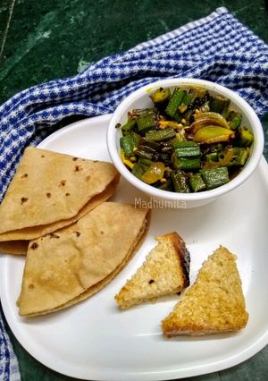 A picture of Bhindi and Onion Fry with roasted cumin powder.