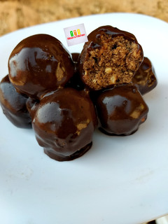 A picture of Tiramisu Truffles in chocolate sauce.