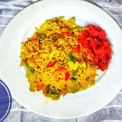 A picture of Fried Rice with Sweet Peppered Chicken.