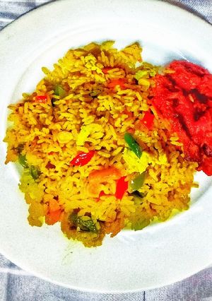 A picture of Fried Rice with Sweet Peppered Chicken.