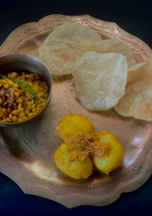 A picture of Durga Ashtami Platter - Luchi, Aloo Dum, Chola’r Dal.
