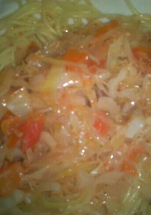 A picture of Fried cabbage and spaghetti.