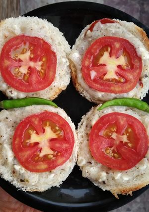 A picture of Cheese onion tomato open toastie.