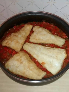 Una foto de Bacalao con tomate