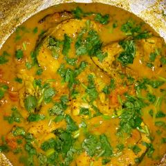 A picture of Fish in gravy.