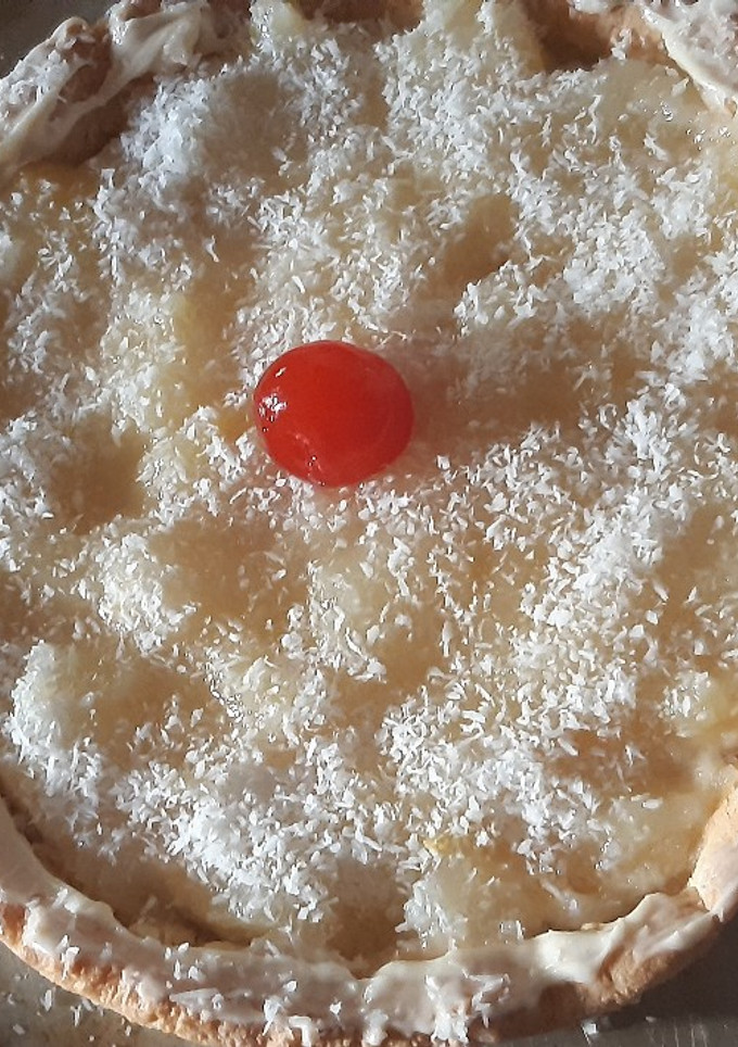 Una foto de Tarta de peras chocolate blanco y coco