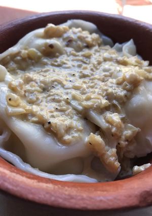 Una foto de Agnolotis de calabaza y queso