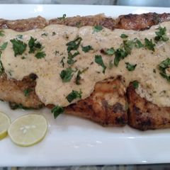 A picture of Grilled fish & lemon butter sauce.