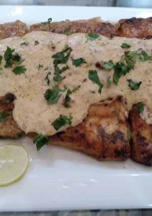 A picture of Grilled fish & lemon butter sauce.
