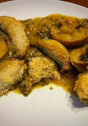 Una foto de Setas y champiñones en salsa Rockefeller
