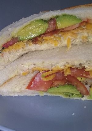 A picture of Chicken mayo, cheese and avocado sandwich.