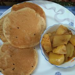 Aloo Curry with Onion Seeds poori A picture of Aloo Curry with Onion Seeds poori.
