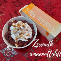 A picture of Beetroot Halwa with Whipped Cream.