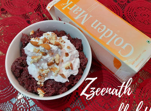 A picture of Beetroot Halwa with Whipped Cream.
