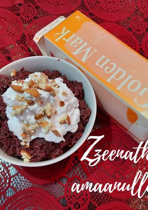 A picture of Beetroot Halwa with Whipped Cream.