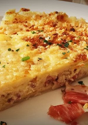 A picture of Quiche with Jamón Ibérico and Manchego Cheese.
