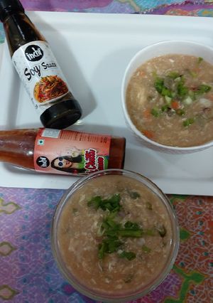 A picture of Eggs and veggies corn soup.