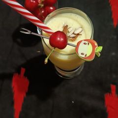 A picture of Cherry mango smoothy🍒🍒🥭🥭.