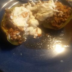 A picture of Stuffed green pepper taco with Parma chip.