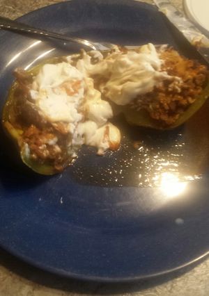 A picture of Stuffed green pepper taco with Parma chip.