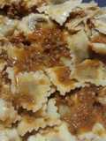 Raviolis de carne con salsa boloña