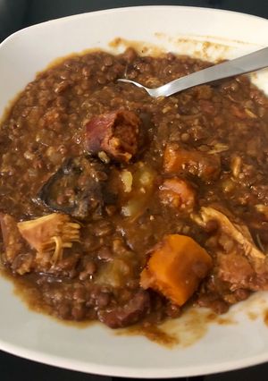 A picture of Fully Loaded Lentils (with Chorizo, Blood Sausage...) in a Crockpot.