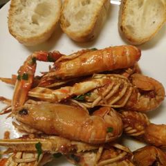 A picture of Langostines in a spicy tomato sauce.