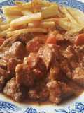 Carne de cerdo en salsa de especias y vinos