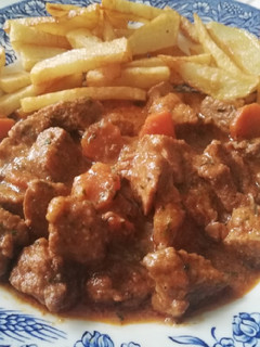 Una foto de Carne de cerdo en salsa de especias y vinos