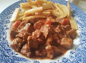 Una foto de Carne de cerdo en salsa de especias y vinos