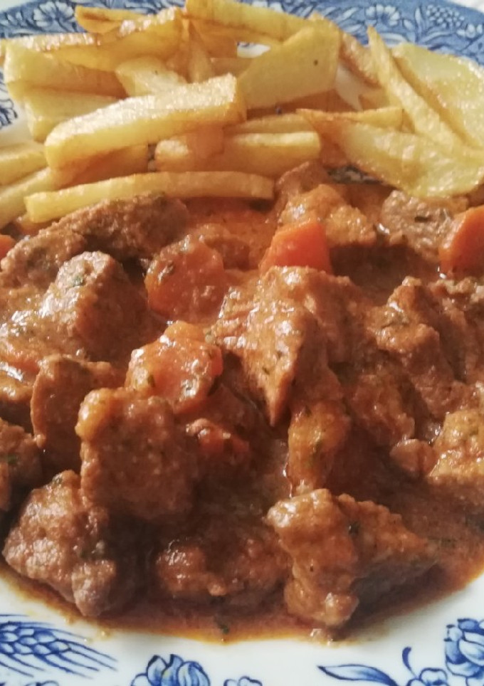 Una foto de Carne de cerdo en salsa de especias y vinos