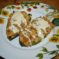A picture of Roasted Poblano Peppers with Chicken & Queso Cheese Sauce.