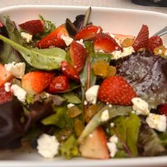 A picture of Mixed green strawberry salad.