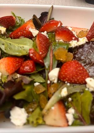 A picture of Mixed green strawberry salad.