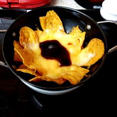 A picture of My Cheeky Nancho,s with Cheese also a blob of whisky BBQ sauce😋.