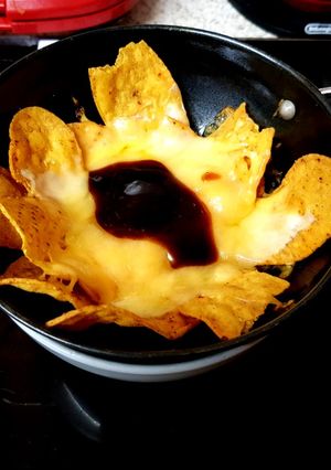 A picture of My Cheeky Nancho,s with Cheese also a blob of whisky BBQ sauce😋.