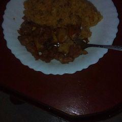 A picture of Fried pork with rice.