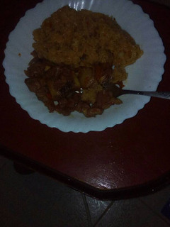 A picture of Fried pork with rice.