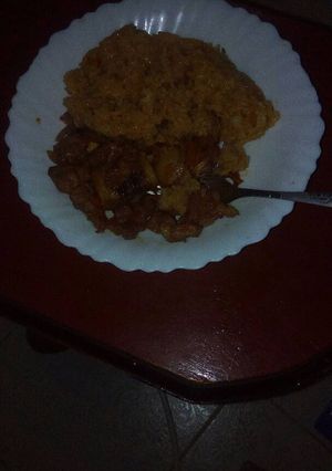 A picture of Fried pork with rice.