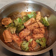 A picture of Crispy tofu and broccoli stir fry with ginger garlic sauce.