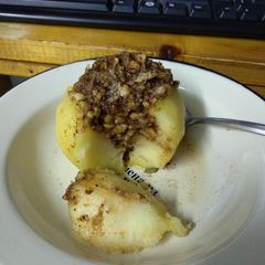 A picture of Boiled apple with walnuts.