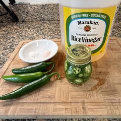 A picture of Pickled Serrano peppers.
