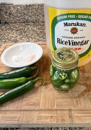 A picture of Pickled Serrano peppers.