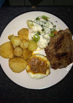 A picture of Tasty potatoes and meat.
